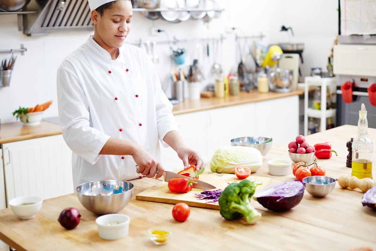 Chef preparing a meal in a kitchen